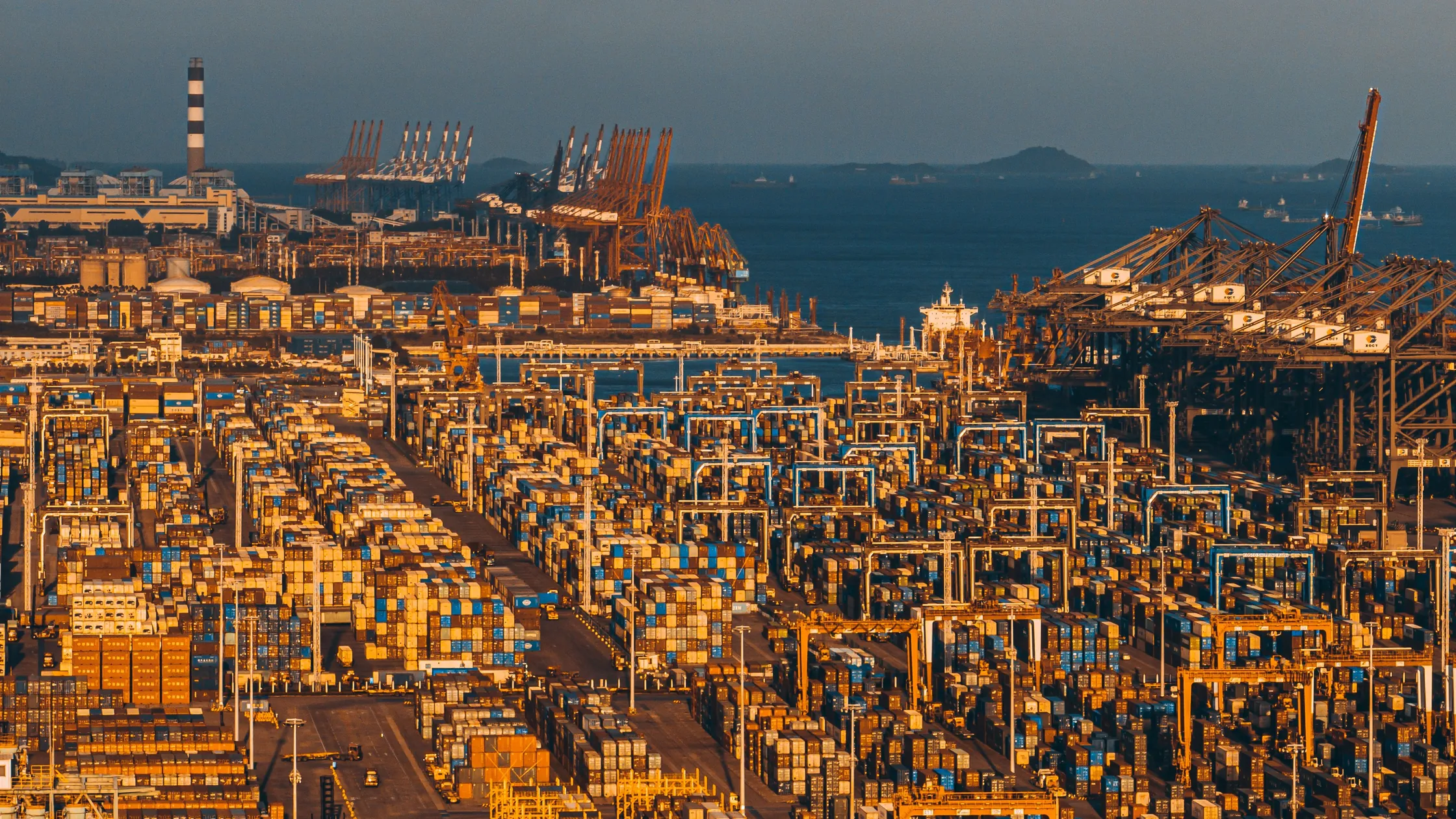 Shipping containers and cranes at a cargo terminal